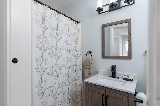 bathroom featuring vanity and a shower with shower curtain