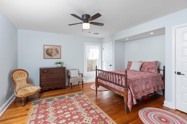 bedroom with wood finished floors, visible vents, baseboards, recessed lighting, and ceiling fan