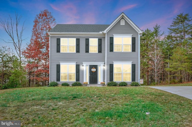 view of front of property with a lawn