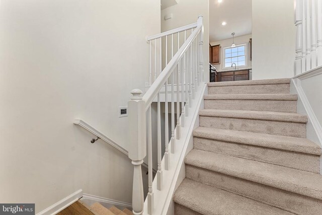 stairs featuring sink