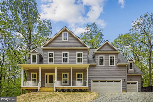 view of front of house featuring a garage and covered porch