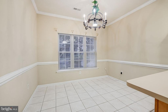 unfurnished dining area with ornamental molding and a chandelier