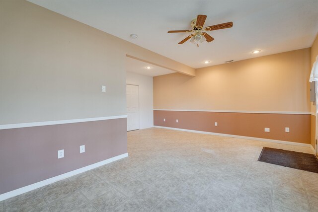 spare room with ceiling fan