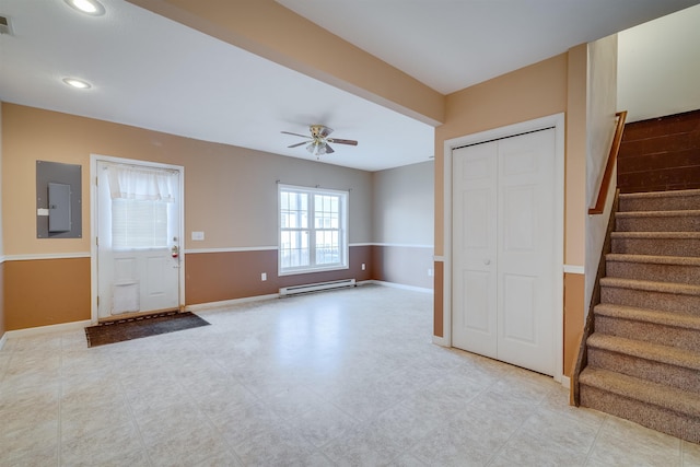 entryway featuring ceiling fan, electric panel, and baseboard heating