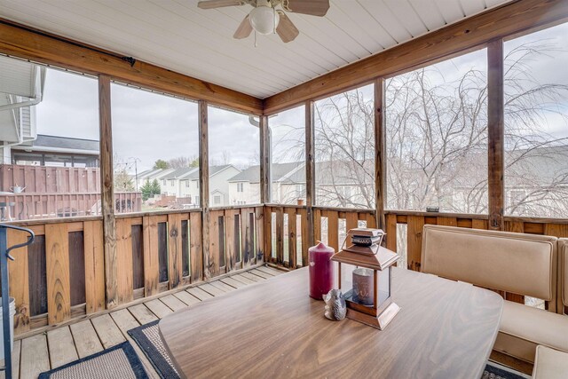 sunroom / solarium featuring ceiling fan