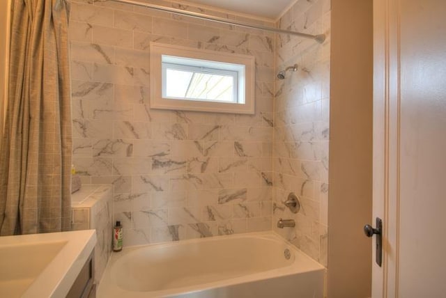 full bathroom featuring shower / tub combo and vanity