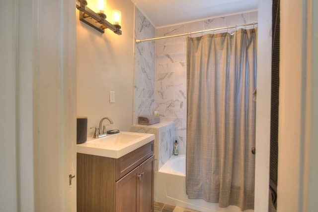 bathroom with shower / tub combo with curtain and vanity