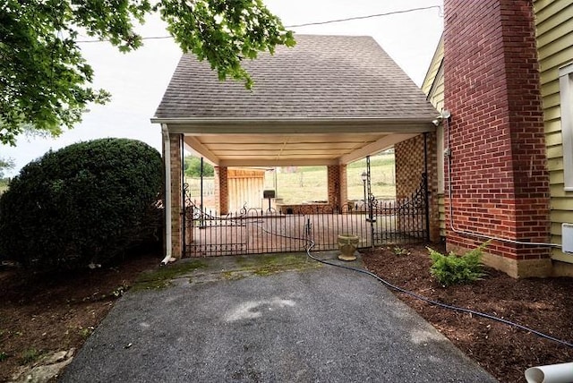 view of gate with a patio area