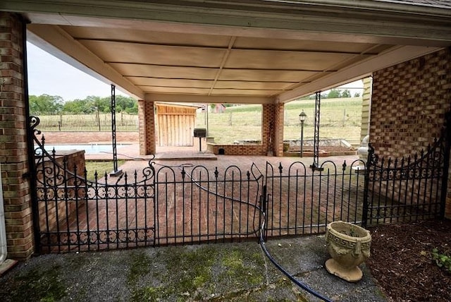 view of patio / terrace with a gate and fence