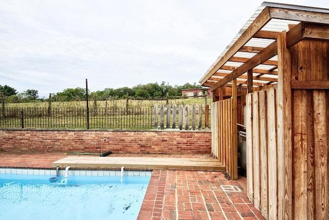 view of swimming pool featuring a fenced in pool and fence