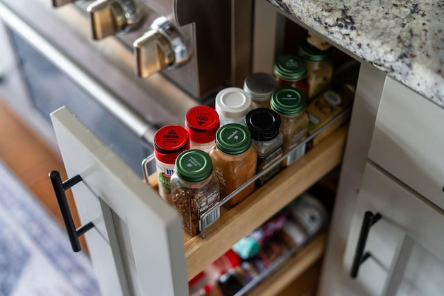 details featuring light stone countertops