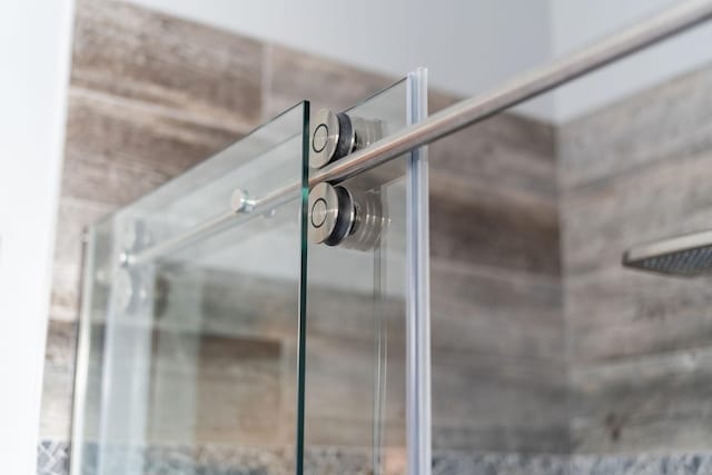 interior details featuring walk in shower