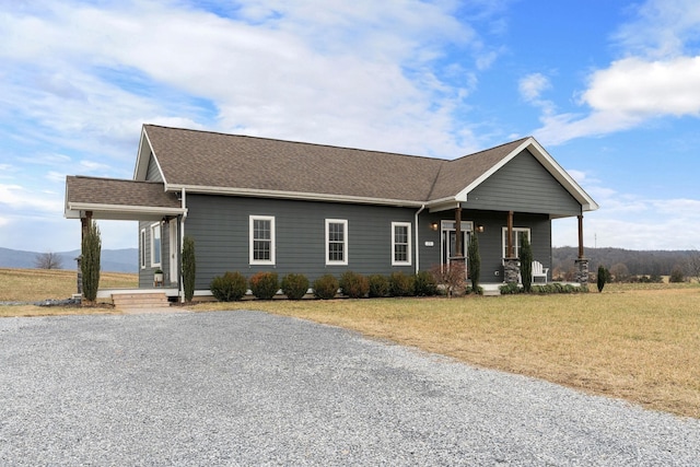 view of front of home with a front lawn and covered porch