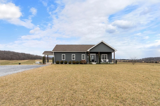 view of front facade with a porch and a front lawn