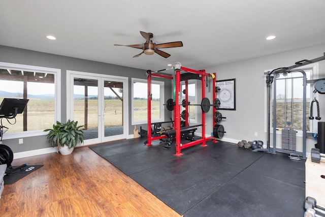 exercise area with ceiling fan and french doors