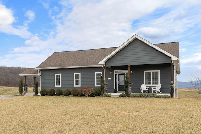 craftsman house with a porch and a front yard