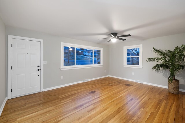 interior space with hardwood / wood-style floors and ceiling fan