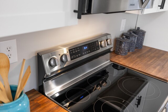 interior details featuring stainless steel electric stove