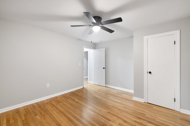 unfurnished room with light hardwood / wood-style flooring and ceiling fan