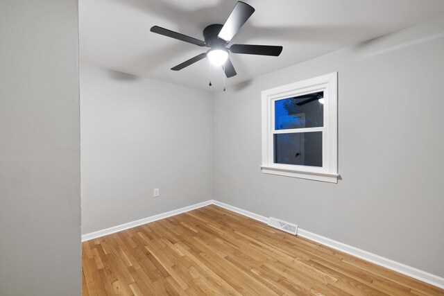 spare room featuring ceiling fan and light wood-type flooring