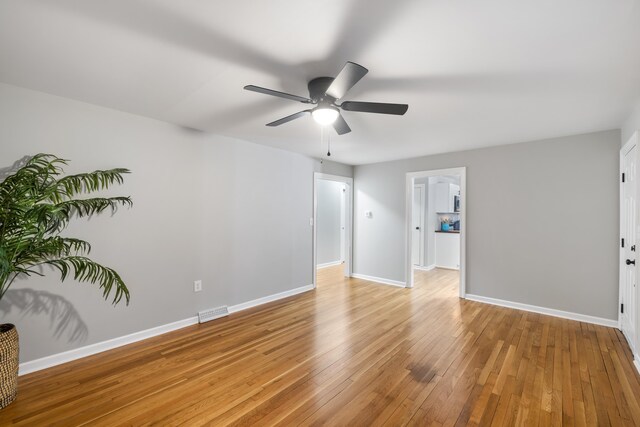 unfurnished room with light hardwood / wood-style flooring and ceiling fan