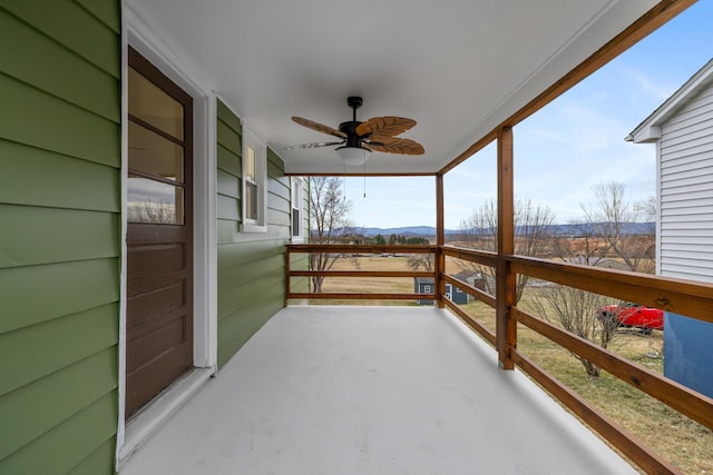 exterior space featuring ceiling fan