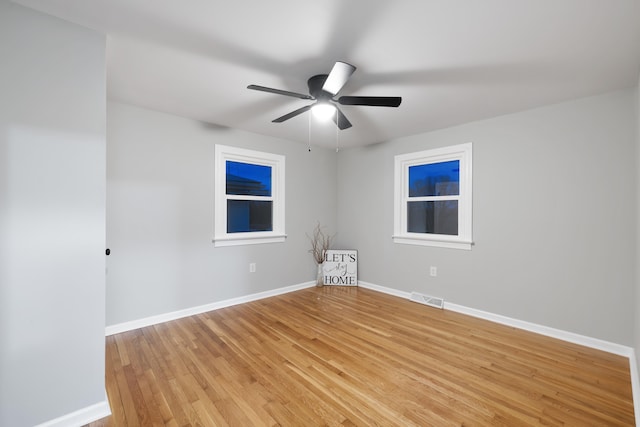 unfurnished room featuring ceiling fan and light hardwood / wood-style floors