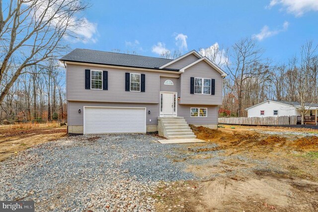 raised ranch featuring a garage