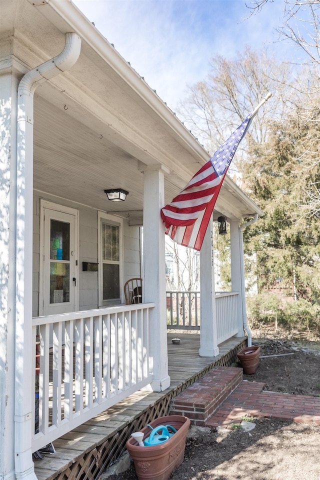 entrance to property featuring a porch