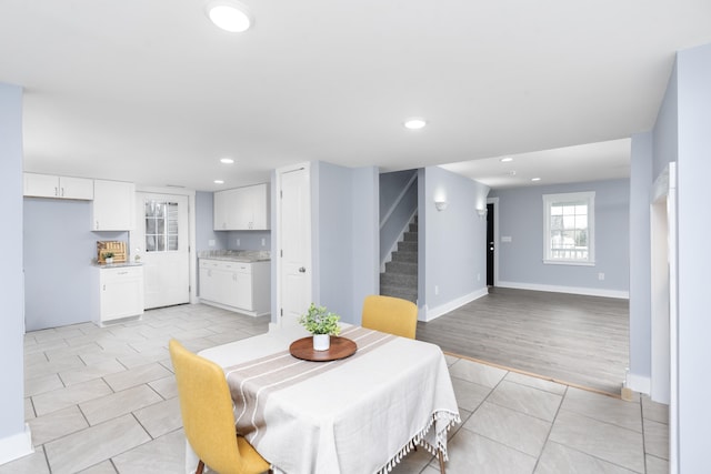 dining area with recessed lighting, stairs, baseboards, and light tile patterned flooring
