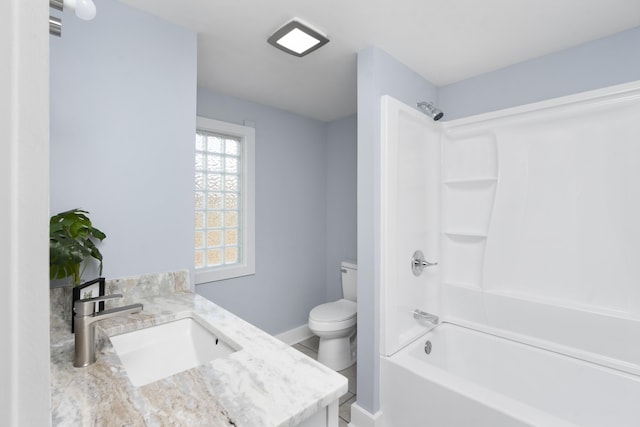 full bathroom with toilet, shower / tub combination, vanity, and baseboards