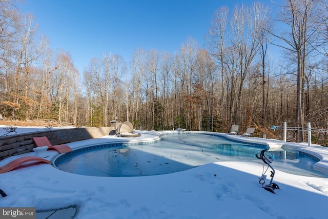 view of snow covered pool