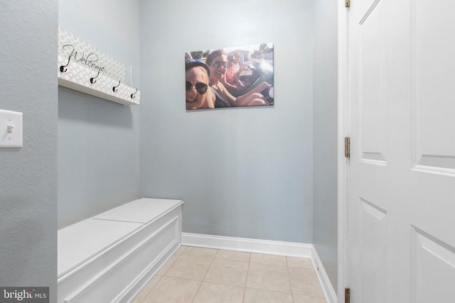 mudroom with light tile patterned floors