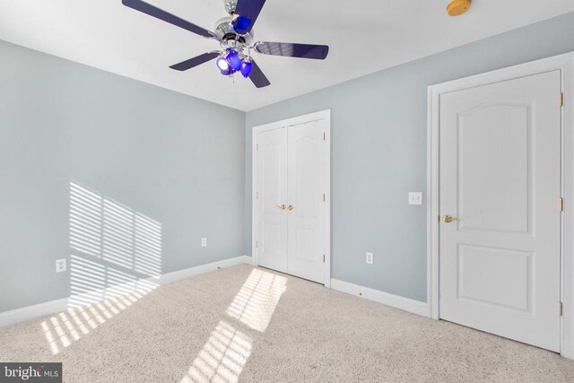 unfurnished bedroom featuring a closet and ceiling fan