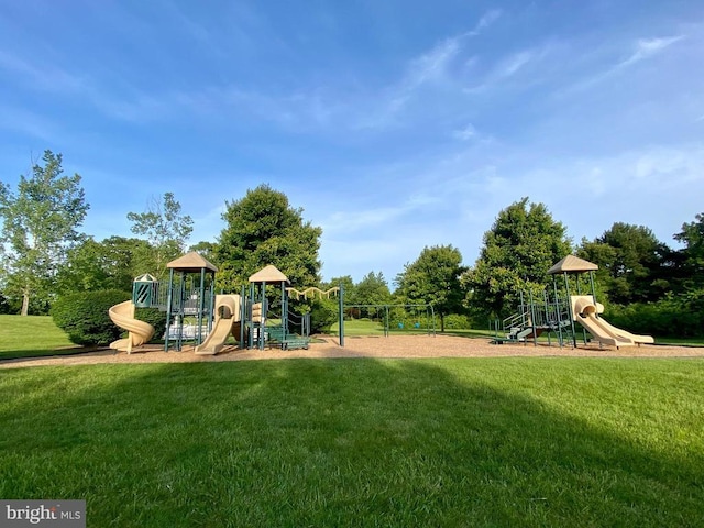 community jungle gym with a lawn