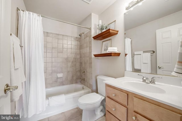 bathroom with shower / tub combo with curtain, toilet, vanity, and tile patterned flooring