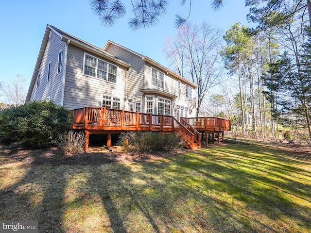 back of property featuring a deck and a yard