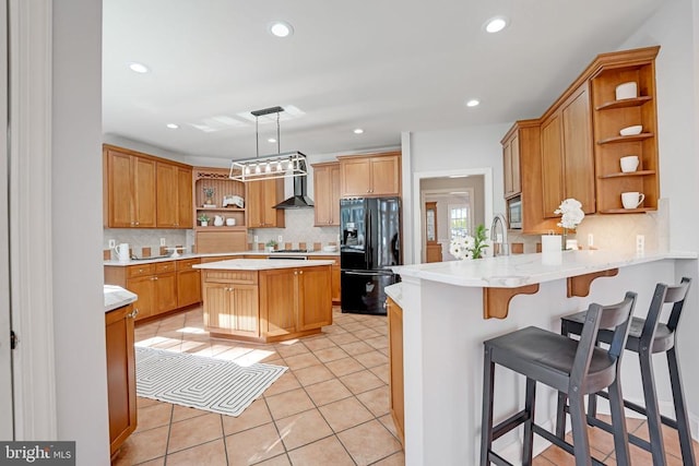 kitchen featuring light tile patterned floors, recessed lighting, a peninsula, black fridge with ice dispenser, and open shelves