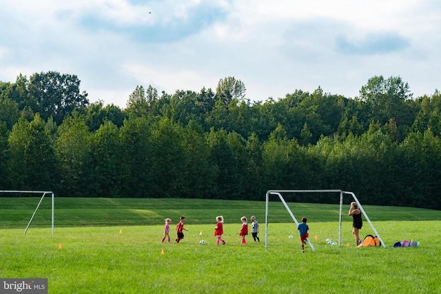 view of community with a forest view