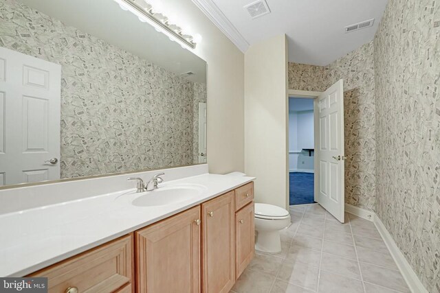 bathroom featuring visible vents, toilet, and wallpapered walls