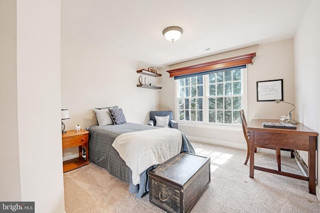 bedroom featuring visible vents, carpet floors, and baseboards