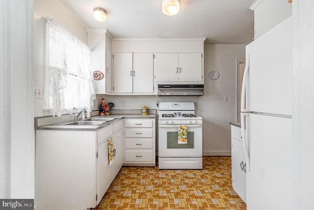 kitchen with white appliances, white cabinets, light countertops, under cabinet range hood, and a sink