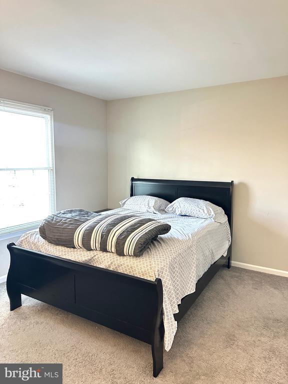 bedroom with light carpet