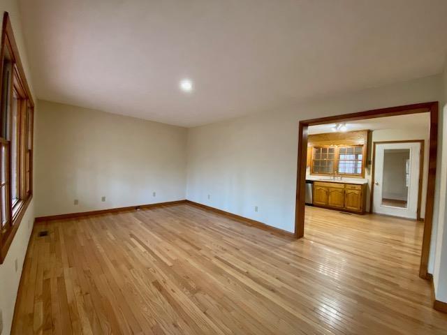 spare room featuring light hardwood / wood-style floors