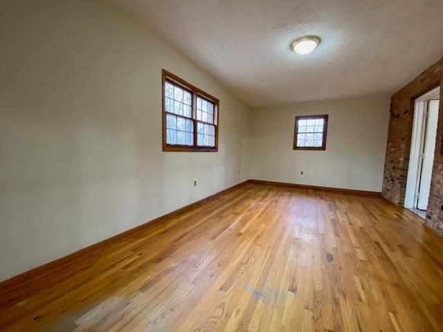 unfurnished room featuring light wood-type flooring