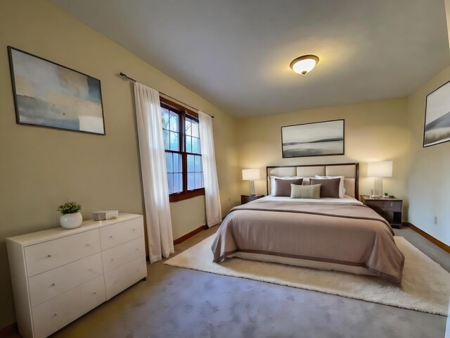 bedroom with light colored carpet