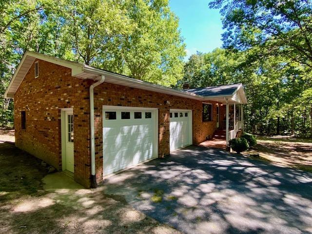 view of side of property with a garage