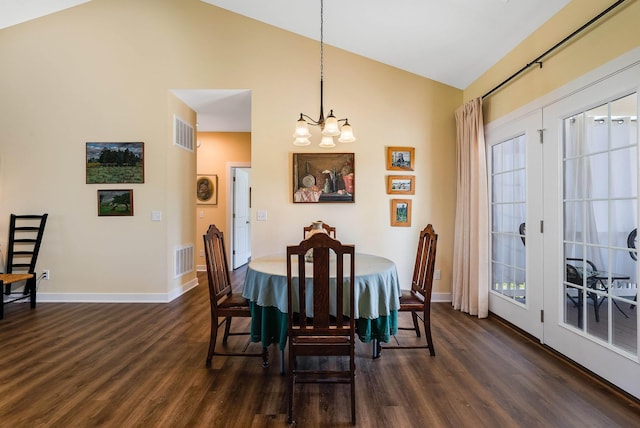 dining room with baseboards, dark wood-type flooring, visible vents, and an inviting chandelier