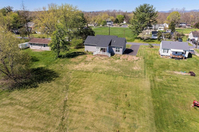 birds eye view of property with a residential view