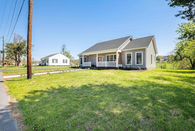 view of front facade with covered porch and a front yard